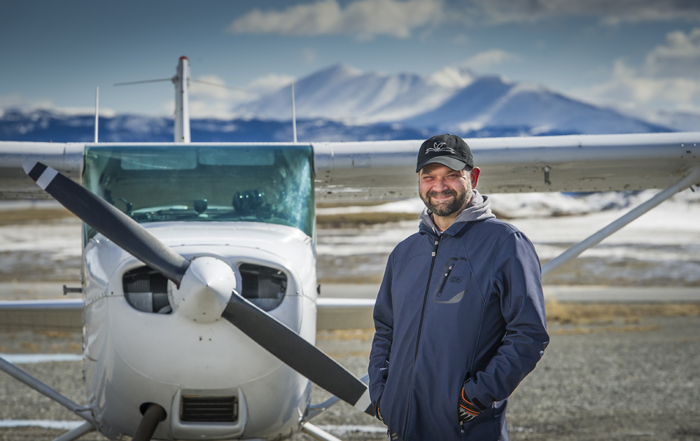 Man standing beside plane.