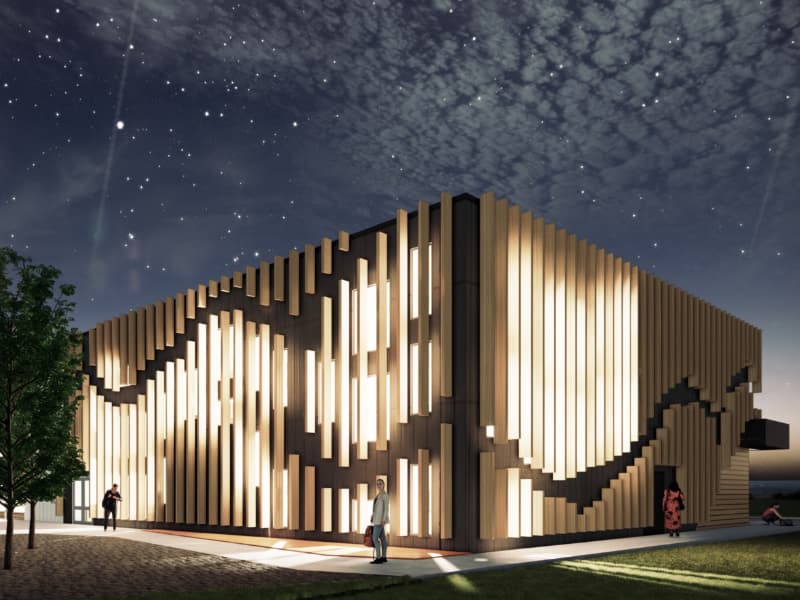 Rendering of the science building illuminated at night