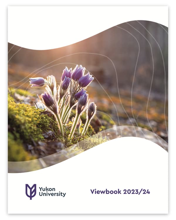 Cover of the 2023-24 Yukon University viewbook featuring a photo with crocuses