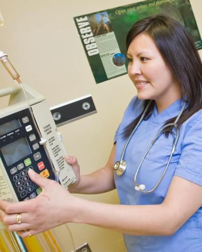 Nursing student wearing scrubs and a stethoscope