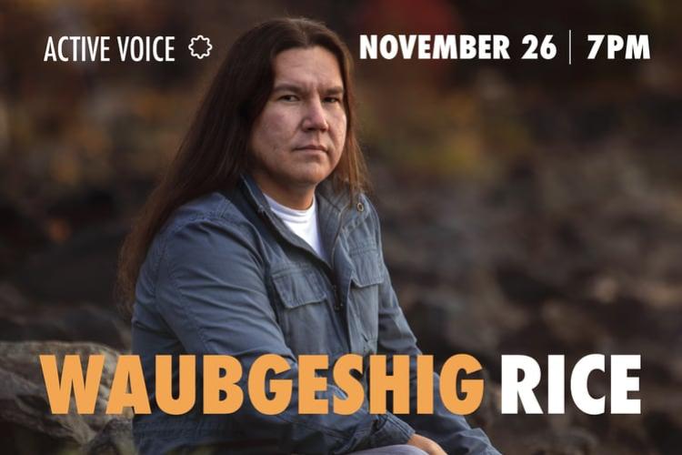 Photo of Waubgeshig Rice, a man with long brown hair, seated and wearing a long sleeve blue shirt