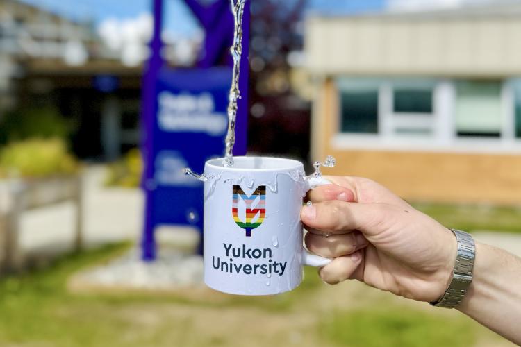 YukonU mug with splashing water