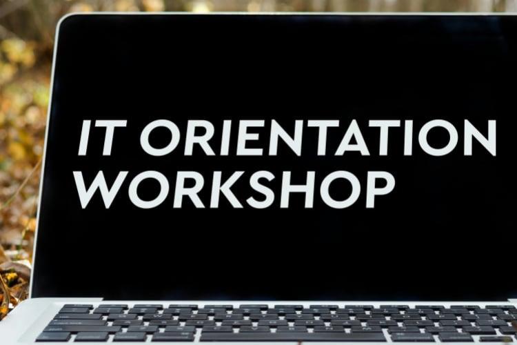 Laptop screen with the words "IT Orientation Workshop"