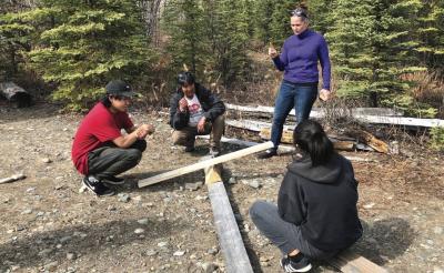 Students being taught about levers in an outdoor setting