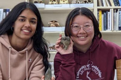 Mavis and Tessie pose with artifacts