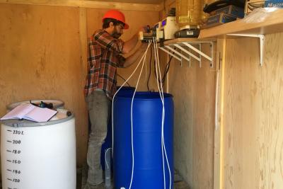 Dr. Nielson installs two bioreactors inside a heated shed at Eagle Gold mine.