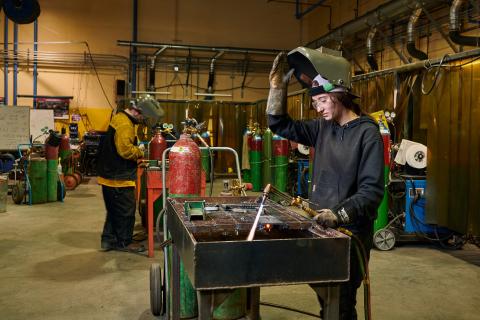 a woman welding