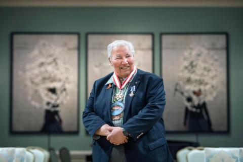 Image of Justice Murray Sinclair, an Indigenous Elder wearing beaded medallion and wearing suit.