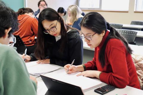 Students of the certificate studying together in a classroom