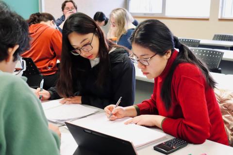 Students of the certificate studying together in a classroom