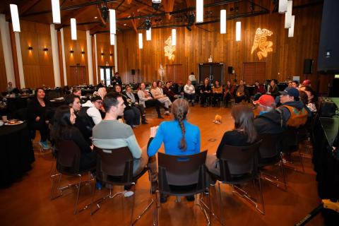 Participants at the fourth annual Yukon Strategy for Patient Oriented Research health summit sit together in a circle at the Kwanlin Dun Cultural Centre