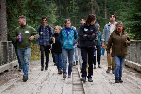 Yukon Native Teacher Education Program (YNTEP) orientation students on a walk with educator Darlene Scurvy exploring the traditional medicines found along the Wolf Creek trails.