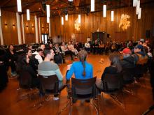 Participants at the fourth annual Yukon Strategy for Patient Oriented Research health summit sit together in a circle at the Kwanlin Dun Cultural Centre