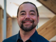 a headshot of Peter Johnston, AVP SI